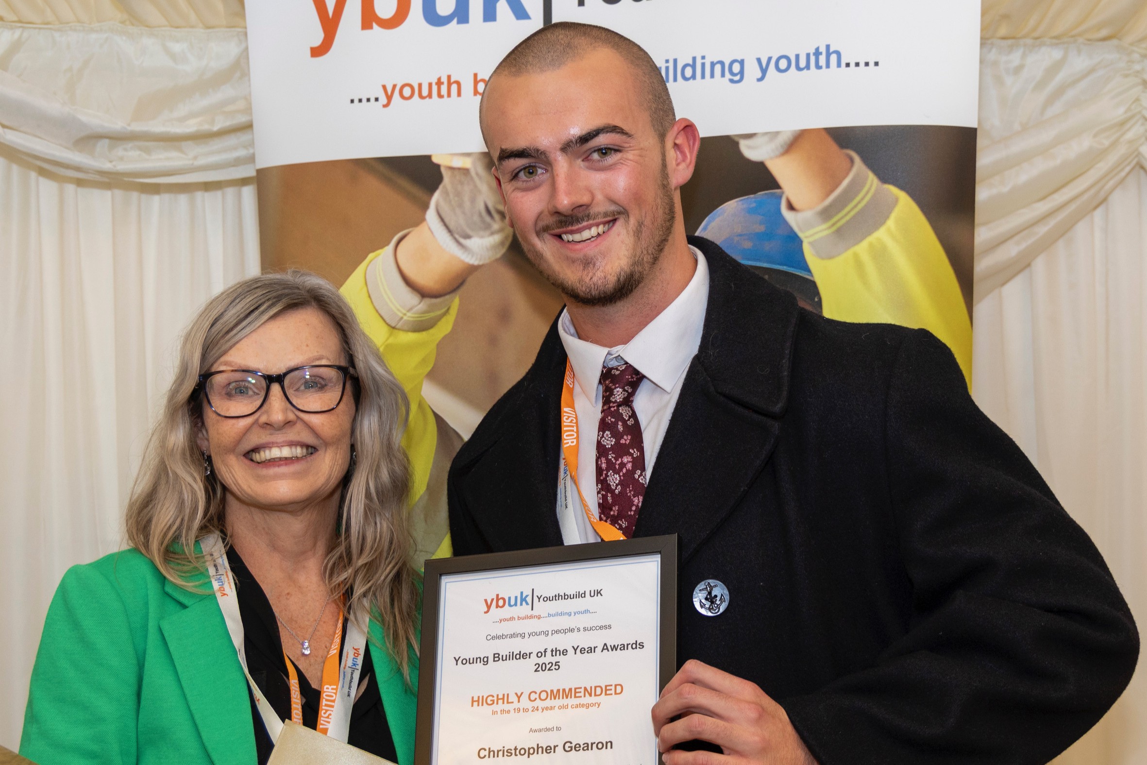 Christopher Gearon (right), a Flagship Services plumber who recently qualified from his apprenticeship, with his ‘highly commended’ award at the recent YouthBuild UK awards (credit: YouthBuild UK)